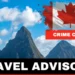 Urgent Travel Advisory for Saint Lucia: Image showing the iconic Pitons under a blue sky, with a Canadian flag marked 'Crime Caution' signifying a warning for Canadian travelers
