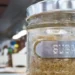 Brown sugar in a glass jar labeled 'sugar,' symbolizing the Caribbean Sugar Association's focus on regional sugar production.