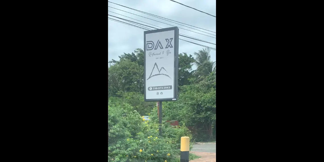 Sign of Dax Restaurant & Bar, linked to the Saint Lucia money laundering scandal, owned by government attaché Dax Norville.