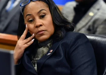 Fulton County District Attorney Fani Willis appearing thoughtful in court during proceedings related to the Fani Willis case.