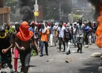Haiti protesters march in defiance as Haiti gang violence escalates, demanding action and safety for their communities.