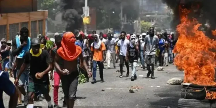 Haiti protesters march in defiance as Haiti gang violence escalates, demanding action and safety for their communities.