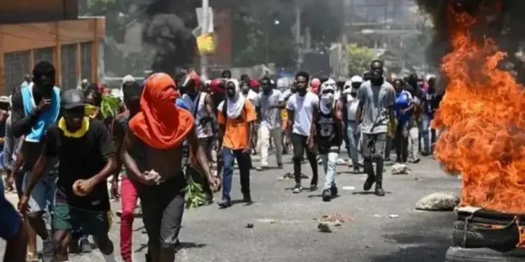 Haiti gang violence protesters near burning tires in Port-au-Prince