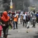 Haiti protesters march in defiance as Haiti gang violence escalates, demanding action and safety for their communities.