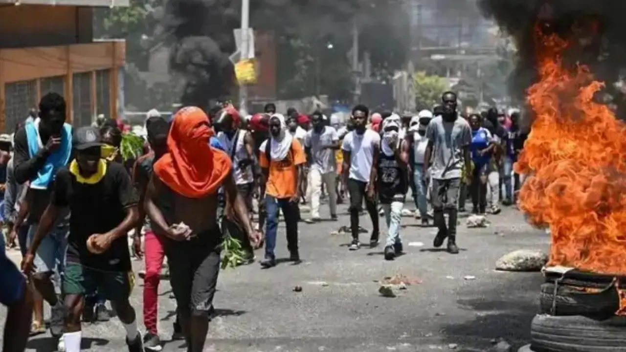 Haiti gang violence protesters near burning tires in Port-au-Prince