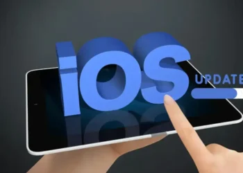 Finger tapping on a tablet screen with 3D text 'iOS Update' loading bar, symbolizing the Apple iOS 17.4 Security Update for enhanced protection.