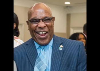 Richard Frederick, pictured smiling in a formal suit, as referenced in the Open Letter to Richard Frederick addressing governance issues.