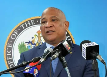 Ernest Hiliare standing at the Podium during a pre-cabinet briefing addressing media on the Saint Lucia CBI Scandal
