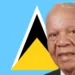 Sir John Compton standing proudly in front of the Saint Lucia flag, symbolizing the Sir John Compton Legacy and his dedication to the nation
