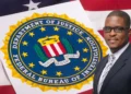 CIP CEO Mc Claude Emmanuel in front of the seal of the Department of Justice