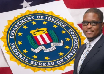 CIP CEO Mc Claude Emmanuel in front of the seal of the Department of Justice