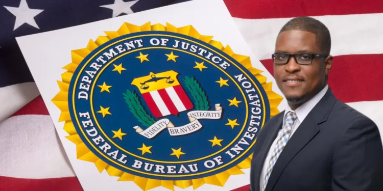 CIP CEO Mc Claude Emmanuel in front of the seal of the Department of Justice