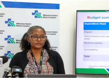Dr. Bernadette Joseph-Labadie addressing the media at a press conference on OKEU Hospital bed shortages, highlighting critical issues in the healthcare system.