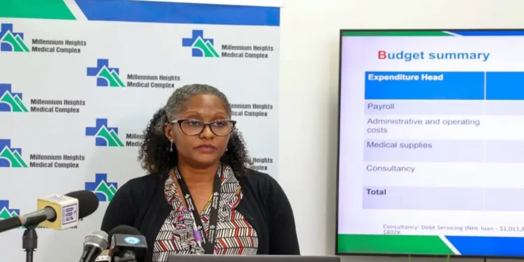 Dr. Bernadette Joseph-Labadie addressing the media at a press conference on OKEU Hospital bed shortages, highlighting critical issues in the healthcare system.