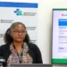 Dr. Bernadette Joseph-Labadie addressing the media at a press conference on OKEU Hospital bed shortages, highlighting critical issues in the healthcare system.