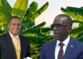 Guy Joseph and Philip J Pierre in photo with a banana field in the background highlighting how the UWP forces government to address the farmers compensation