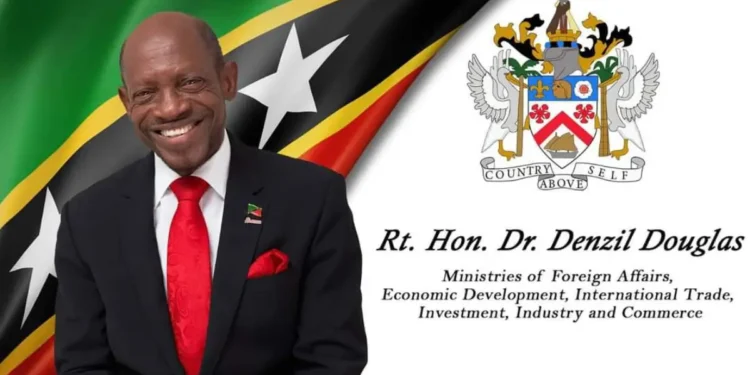 In Photo a smiling Dr. Denzil Douglas served with the MSR Media RICO lawsuit during a government cabinet meeting.