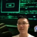 Lin Rui Siang, depicted against a dark web background, accused of leading a major drug trafficking network while training Saint Lucia police in cryptocurrency crime.