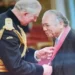 Dr. George Martin Didier, a Saint Lucia healthcare legend, receiving an honor from then-Prince Charles.