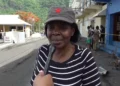 Emma Hippolyte, the district representative for Soufriere Fond St. Jacques, being interviewed on the Soufriere waterfront amidst the aftermath of Hurricane Beryl, reflecting her involvement in partisan politics in disaster relief St. Lucia.