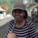 Emma Hippolyte, the district representative for Soufriere Fond St. Jacques, being interviewed on the Soufriere waterfront amidst the aftermath of Hurricane Beryl, reflecting her involvement in partisan politics in disaster relief St. Lucia.