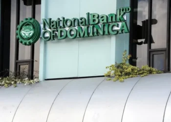 Front facade of the National Bank of Dominica building, illustrating the Caribbean bank crisis amid Citizenship by Investment program scrutiny and de-risking measures.