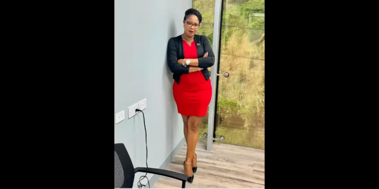 Isa Cyril in a red dress with a black overcoat resigns amid the Saint Lucia CIP Scandal 2024.