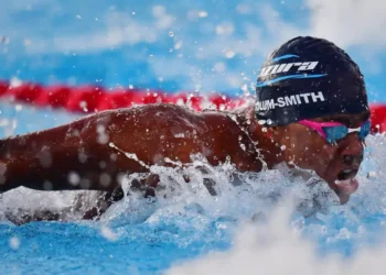 Jayhan Odlum-Smith swimming in the pool during his race at the Paris Olympics, setting a new national record for Saint Lucia.