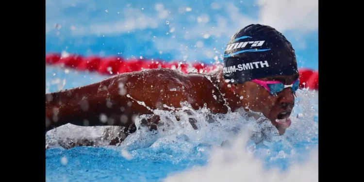 Jayhan Odlum-Smith swimming in the pool during his race at the Paris Olympics, setting a new national record for Saint Lucia.