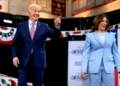 Joe Biden and Kamala Harris on stage during a campaign rally, discussing Biden 2024 re-election decision