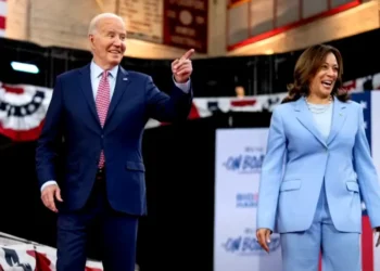 Joe Biden and Kamala Harris on stage during a campaign rally, discussing Biden 2024 re-election decision