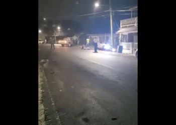 Scene of the dramatic Saint Lucia police chase incident in Anse La Raye, showing the damaged suspect vehicle and police presence.
