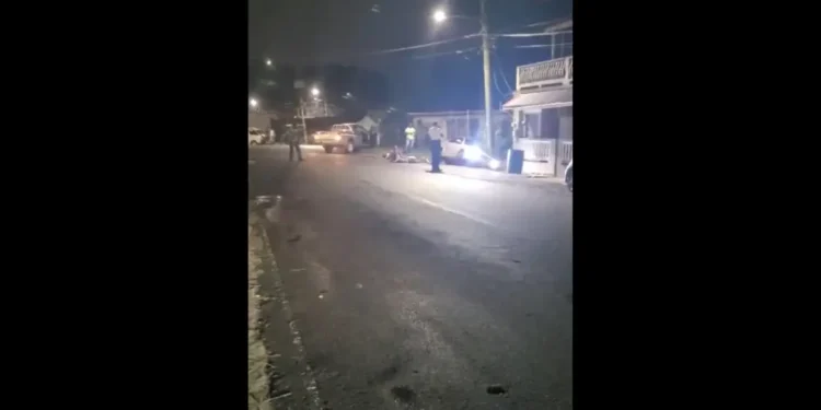 Scene of the dramatic Saint Lucia police chase incident in Anse La Raye, showing the damaged suspect vehicle and police presence.