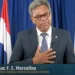Sint Maarten Prime Minister Luc F. E. Mercelina addressing the nation following the tragic Sint Maarten attack news, calling for unity and resilience.