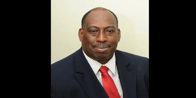 Dr. Dexter James in a red tie, pictured shortly before announcing "Millennium Heights CEO Resigns" amid healthcare challenges.