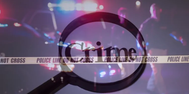 Emergency vehicle with flashing lights responding to a Trouya gun violence incident, highlighting the urgent response to the shooting.