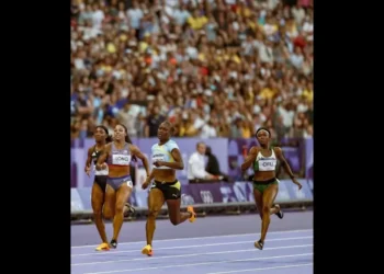 Julien Alfred 200m Final Paris 2024 Julien Alfred cruising towards the finish line in the 200m semi-final, securing a 21.98s run.