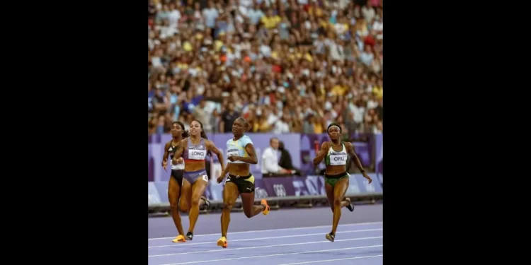 Julien Alfred 200m Final Paris 2024 Julien Alfred cruising towards the finish line in the 200m semi-final, securing a 21.98s run.