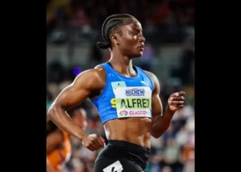 Julien Alfred Olympic Debut Saint Lucian sprinter Julien Alfred poised on the track during her impressive performance at the 2024 Paris Olympics.
