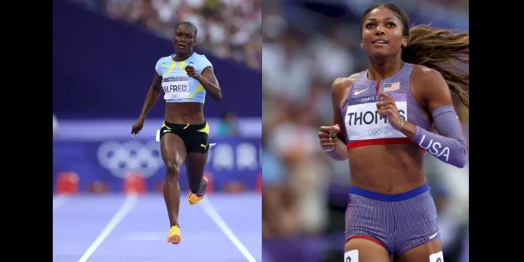 Julien Alfred Olympic silver medal winner standing side by side with Gabby Thomas on the track during the Women's 200m Final at Paris 2024