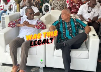 Philip J Pierre and Ernest Hilaire seated side by side at a carnival event amidst the ongoing Saint Lucia CIP Board controversy.