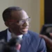 Philip J. Pierre speaking to the media, illustrating his involvement in the "Philip J. Pierre deceitful blame game" over the CIP scandal.