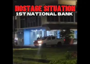 Police responding to the 1st National Bank Robbery at the Choc branch in Saint Lucia, with officers securing the area after the heist.
