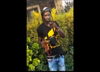 Troy Albert holding a marijuana spliff, identified as the victim in the Troy Albert Barre Denis shooting, Saint Lucia’s 53rd homicide.