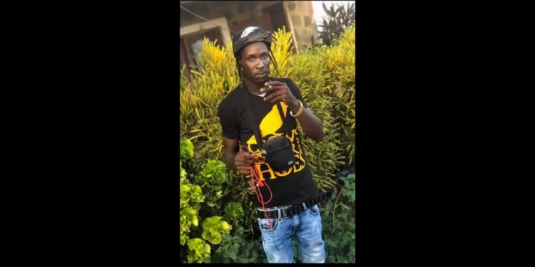 Troy Albert holding a marijuana spliff, identified as the victim in the Troy Albert Barre Denis shooting, Saint Lucia’s 53rd homicide.