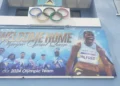 Billboard showcasing Julien Alfred in Saint Lucia, celebrating her historic Olympic wins, as part of the Julien Alfred Homecoming festivities