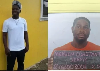 Bordelais inmate recaptured: Mervin Jeremie Constantine in a white shirt and cap, displays his prison number after his escape and arrest.