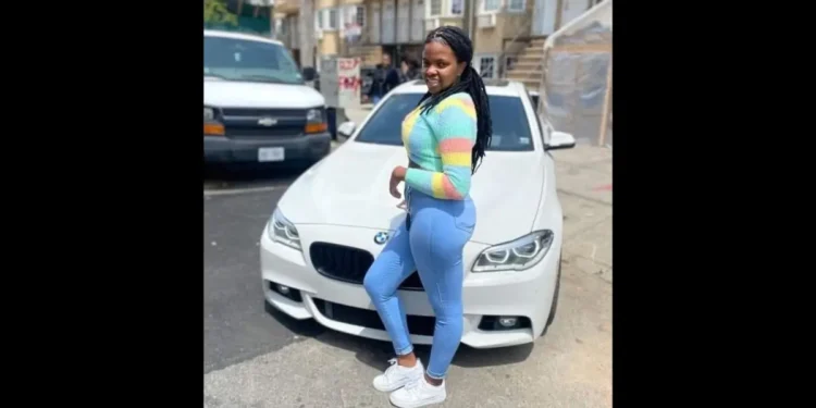 Christina Cephinis, the Saint Lucian woman at the center of a Brooklyn homicide investigation, posing in front of a white BMW.