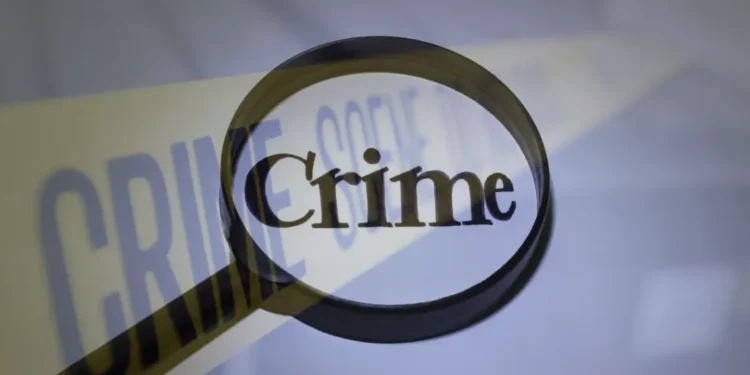 Depiction of crime scene tape marking the area of the stabbing of a Dennery fisherman, highlighting Saint Lucia's 60th homicide in 2024.