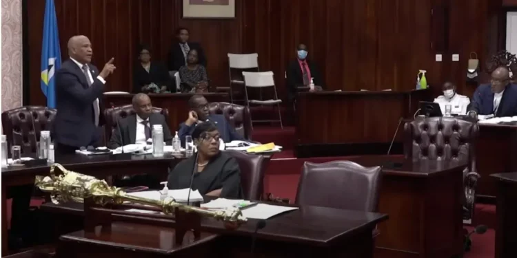 Ernest Hilaire stands in Parliament with Leslie Mondesir and Philip J Pierre amid growing scrutiny in the Saint Lucia citizenship scandal.